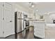 Modern kitchen featuring stainless steel appliances, granite counters and white cabinets at 2118 Cherry Tree Ln, Peachtree City, GA 30269