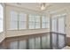 Sunroom filled with natural light, hardwood floors and large windows at 2118 Cherry Tree Ln, Peachtree City, GA 30269