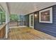 Spacious covered back deck with wood flooring and white railings, an ideal outdoor retreat at 270 Carrolls Way, Fayetteville, GA 30215