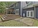 Backyard with a wooden deck, double doors, and propane tank at 270 Carrolls Way, Fayetteville, GA 30215