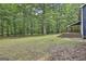 Spacious backyard featuring large trees and natural landscaping at 270 Carrolls Way, Fayetteville, GA 30215