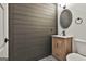 Bathroom featuring dark wooden wall and patterned tile flooring at 270 Carrolls Way, Fayetteville, GA 30215