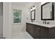Modern bathroom featuring double vanity and dark fixtures at 270 Carrolls Way, Fayetteville, GA 30215