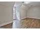 Attic bedroom with angled ceilings, wood floors, and white walls at 270 Carrolls Way, Fayetteville, GA 30215