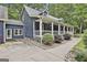 Exterior of a charming home with a full covered front porch and well-maintained landscaping at 270 Carrolls Way, Fayetteville, GA 30215