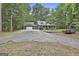 Charming exterior view of home with front porch surrounded by mature trees at 270 Carrolls Way, Fayetteville, GA 30215