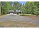 Charming home featuring a spacious front yard, covered porch, and attached garage at 270 Carrolls Way, Fayetteville, GA 30215