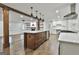 Spacious kitchen with wooden support beams, island with sink, and views to the living room at 270 Carrolls Way, Fayetteville, GA 30215