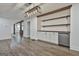 Spacious living area with built-in bar area, modern lighting, and open access to the kitchen at 270 Carrolls Way, Fayetteville, GA 30215