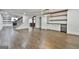 Inviting open-concept space connects the living, dining, and kitchen areas with wood floors at 270 Carrolls Way, Fayetteville, GA 30215
