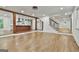 Spacious living area with hardwood floors, open access to the kitchen, and a staircase leading to other floors at 270 Carrolls Way, Fayetteville, GA 30215