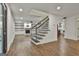 Open-concept home with hardwood floors, a fireplace, and easy access to other rooms, perfect for entertaining at 270 Carrolls Way, Fayetteville, GA 30215