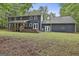 Backyard view showcasing the home's expansive deck and wooded surroundings at 270 Carrolls Way, Fayetteville, GA 30215