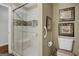 Modern bathroom features a tiled shower with a glass door and a built-in bench at 1120 Upchurch Rd, Mcdonough, GA 30252