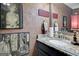 Charming powder room with vintage decor, stylish wallpaper, and a granite vanity at 1120 Upchurch Rd, Mcdonough, GA 30252