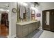 Beautiful bathroom with double vanity, decorative mirrors, and neutral color palette at 1120 Upchurch Rd, Mcdonough, GA 30252