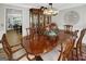 Dining room with a large wooden table, chairs, and a decorative hutch, perfect for gatherings at 1120 Upchurch Rd, Mcdonough, GA 30252
