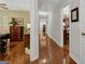 Bright hallway features gleaming hardwood floors, neutral walls, and leads to bedrooms at 1120 Upchurch Rd, Mcdonough, GA 30252