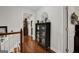 Hallway with hardwood floors and a built-in display case, offering a glimpse into the home's interior at 1120 Upchurch Rd, Mcdonough, GA 30252