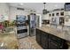 Modern kitchen with stainless steel appliances, a center island, and granite countertops at 1120 Upchurch Rd, Mcdonough, GA 30252