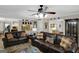 Inviting living room features hardwood floors, a ceiling fan, and comfortable leather sofas at 1120 Upchurch Rd, Mcdonough, GA 30252