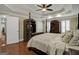 Spacious main bedroom with tray ceiling, hardwood floors, and elegant furnishings at 1120 Upchurch Rd, Mcdonough, GA 30252