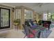 Outdoor screened porch with brick walls, offering a serene retreat with cozy furniture at 1120 Upchurch Rd, Mcdonough, GA 30252