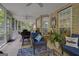Relaxing screened porch with comfortable seating, ideal for outdoor enjoyment at 1120 Upchurch Rd, Mcdonough, GA 30252