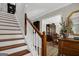 Elegant staircase with wood treads and white risers, showcasing the home's interior at 1120 Upchurch Rd, Mcdonough, GA 30252