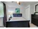 Well-lit bedroom with natural light, ceiling fan, built-in storage, and contemporary décor providing a relaxing ambiance at 405 Abbey Rd, Peachtree City, GA 30269