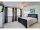 Bright bedroom with multiple windows, neutral carpet, ceiling fan, and comfortable furnishings, creating a serene retreat at 405 Abbey Rd, Peachtree City, GA 30269