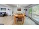 Light-filled dining room featuring a wood table and chairs, with a view to the outside, and the living room at 405 Abbey Rd, Peachtree City, GA 30269