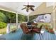 Relaxing back porch featuring a ceiling fan and seating, ideal for enjoying the outdoor views and fresh air at 105 Roxbrough Ln, Fayetteville, GA 30215