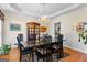 Formal dining room with chandelier, hardwood floors, and wainscoting at 105 Roxbrough Ln, Fayetteville, GA 30215