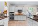 Spacious kitchen with white cabinets, stainless steel appliances, and tile flooring at 105 Roxbrough Ln, Fayetteville, GA 30215