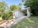Charming brick home featuring a covered carport and a bright red front door at 2103 Keheley Dr, Decatur, GA 30032