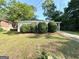 Ranch-style home featuring an expansive front yard with mature landscaping at 2103 Keheley Dr, Decatur, GA 30032