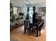 Dining room with modern chandelier, table with seating, and decorative art at 120 Alfred Dr, Carrollton, GA 30116