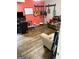 Entertainment room with hardwood floors, guitars hanging on the wall, and comfortable seating area at 120 Alfred Dr, Carrollton, GA 30116