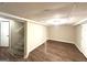 A finished basement featuring new wood floors and a carpeted staircase at 3456 Spring Cir, Decatur, GA 30032