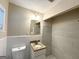 The bathroom features white tiled walls, granite countertop, and updated sink at 3456 Spring Cir, Decatur, GA 30032