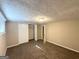 This cozy bedroom features neutral walls, a closet, and a light fixture at 3456 Spring Cir, Decatur, GA 30032