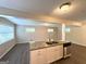Eat-in kitchen featuring a central island with granite countertops and modern appliances at 3456 Spring Cir, Decatur, GA 30032
