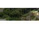 Aerial view of the property showcasing its prime location surrounded by lush greenery at 1492 Bourdon Bell Se Dr, Conyers, GA 30013