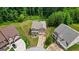 Aerial shot showcasing the home's location among lush trees and manicured lawns at 1492 Bourdon Bell Se Dr, Conyers, GA 30013