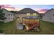 Image featuring the home's exterior with an inviting deck at 1492 Bourdon Bell Se Dr, Conyers, GA 30013