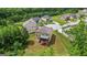 Expansive backyard with mature trees and a screened porch for outdoor enjoyment at 1492 Bourdon Bell Se Dr, Conyers, GA 30013