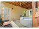 Cozy backyard featuring hot tub, a patio, and outdoor seating at 1492 Bourdon Bell Se Dr, Conyers, GA 30013