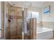 Modern bathroom with tiled shower, soaking tub, and elegant finishes, perfect for relaxation at 1492 Bourdon Bell Se Dr, Conyers, GA 30013