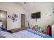 Vaulted ceiling bedroom featuring plush carpet, TV, and a connected bathroom at 1492 Bourdon Bell Se Dr, Conyers, GA 30013
